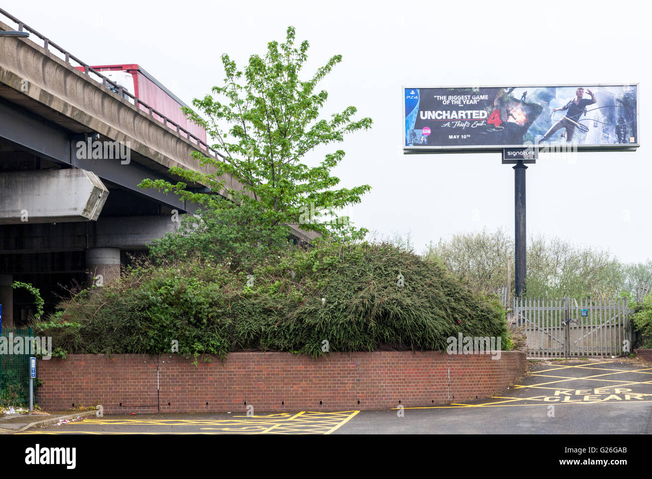 High level electronic advertising billboard next to the M6 motorway, Bescot, Walsall, West Midlands, England, UK Stock Photo