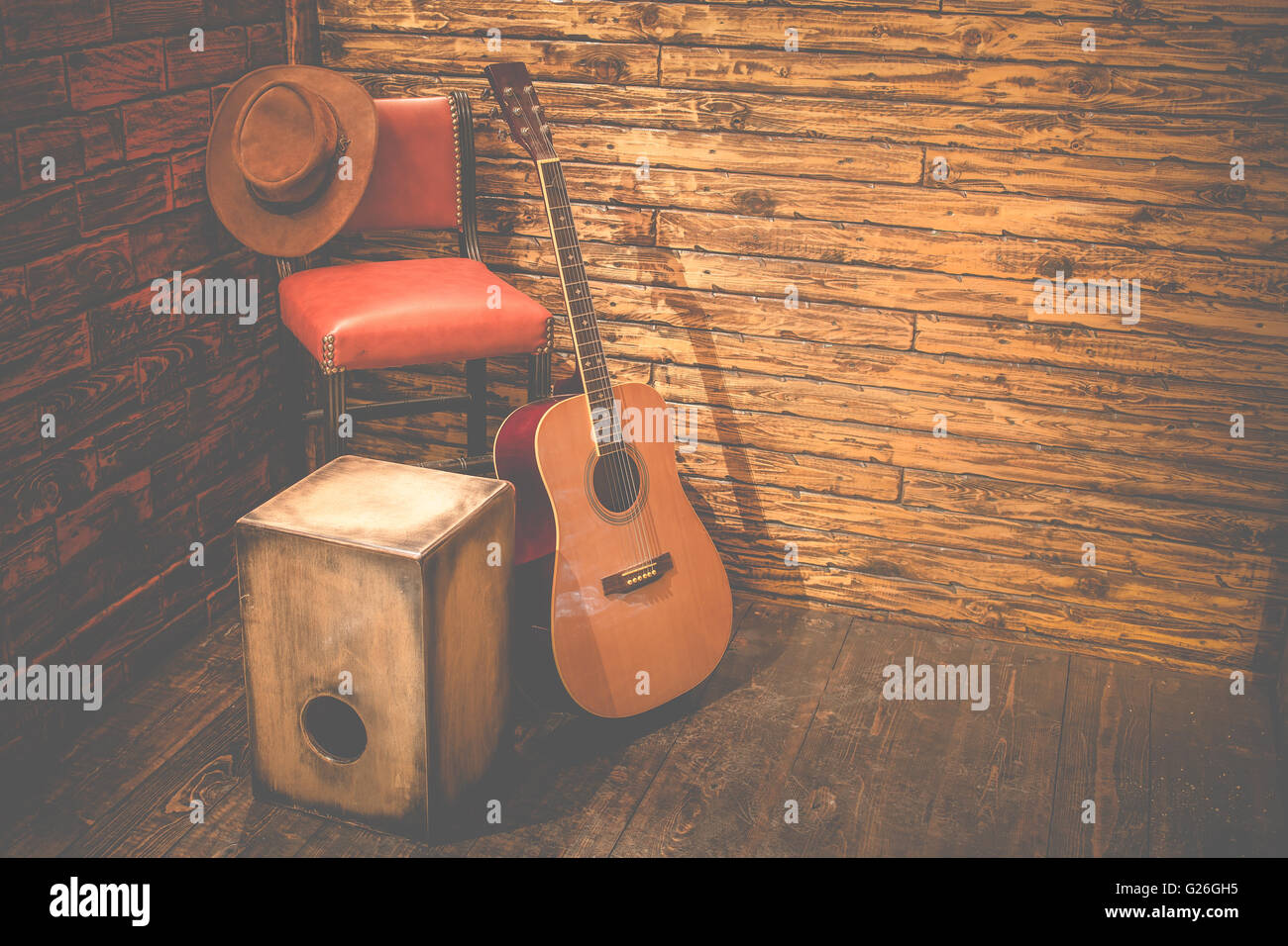 Cajon and acoustic guitar on wooden stage in pub Stock Photo - Alamy