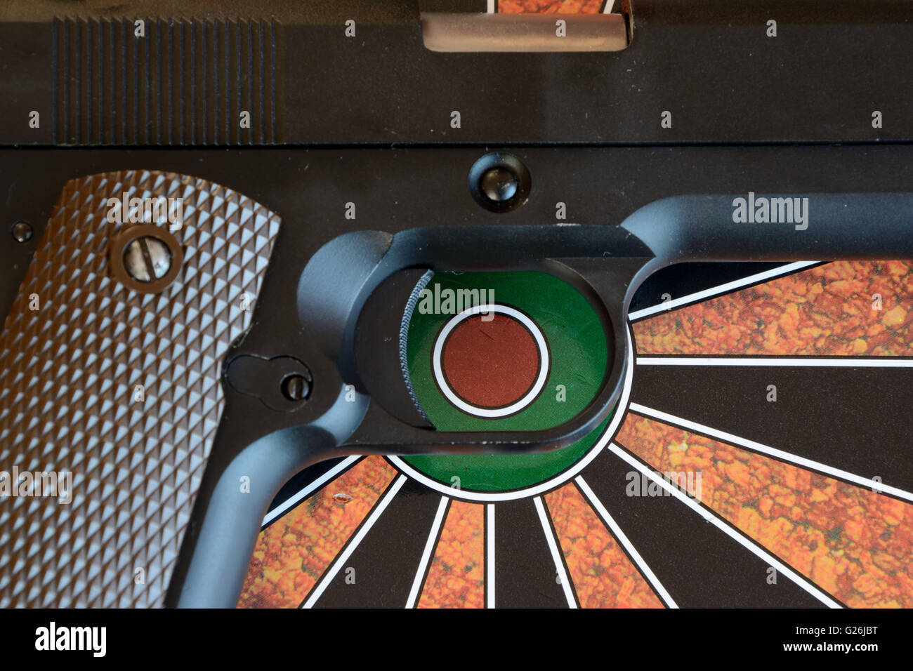 Airsoft gun on target dartboard Stock Photo Alamy