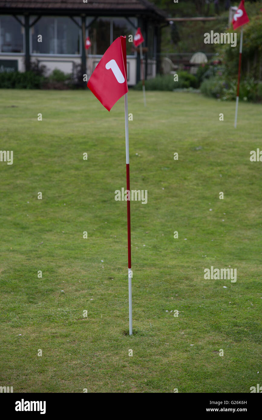 A golf hole flag with the numeral 1 on Stock Photo - Alamy