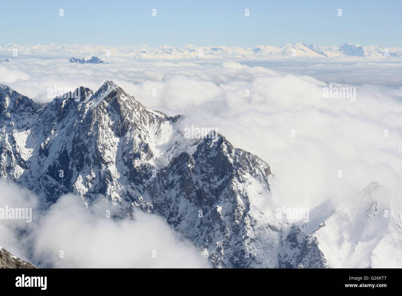 Mountain peaks rise above the clouds, Zugspitze, Germany. Stock Photo