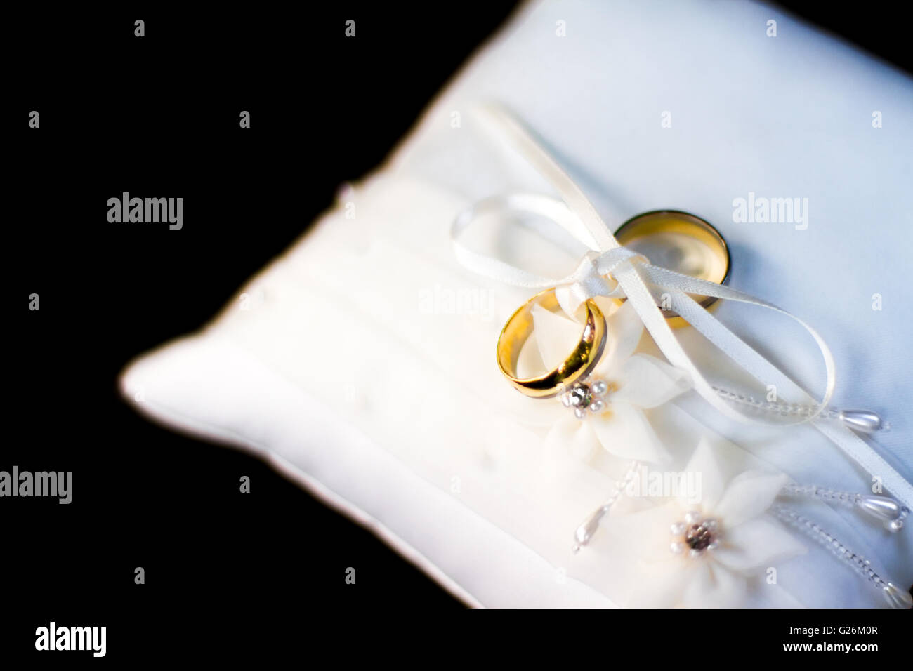 Gold wedding rings on the lace pillow Stock Photo