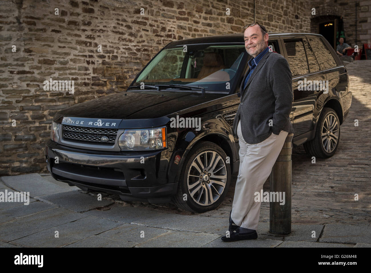 Jean Brouillard, CEO of communication Jean Brouillard, is pictured with his Range Rover in Quebec city on May 4, 2015 Stock Photo