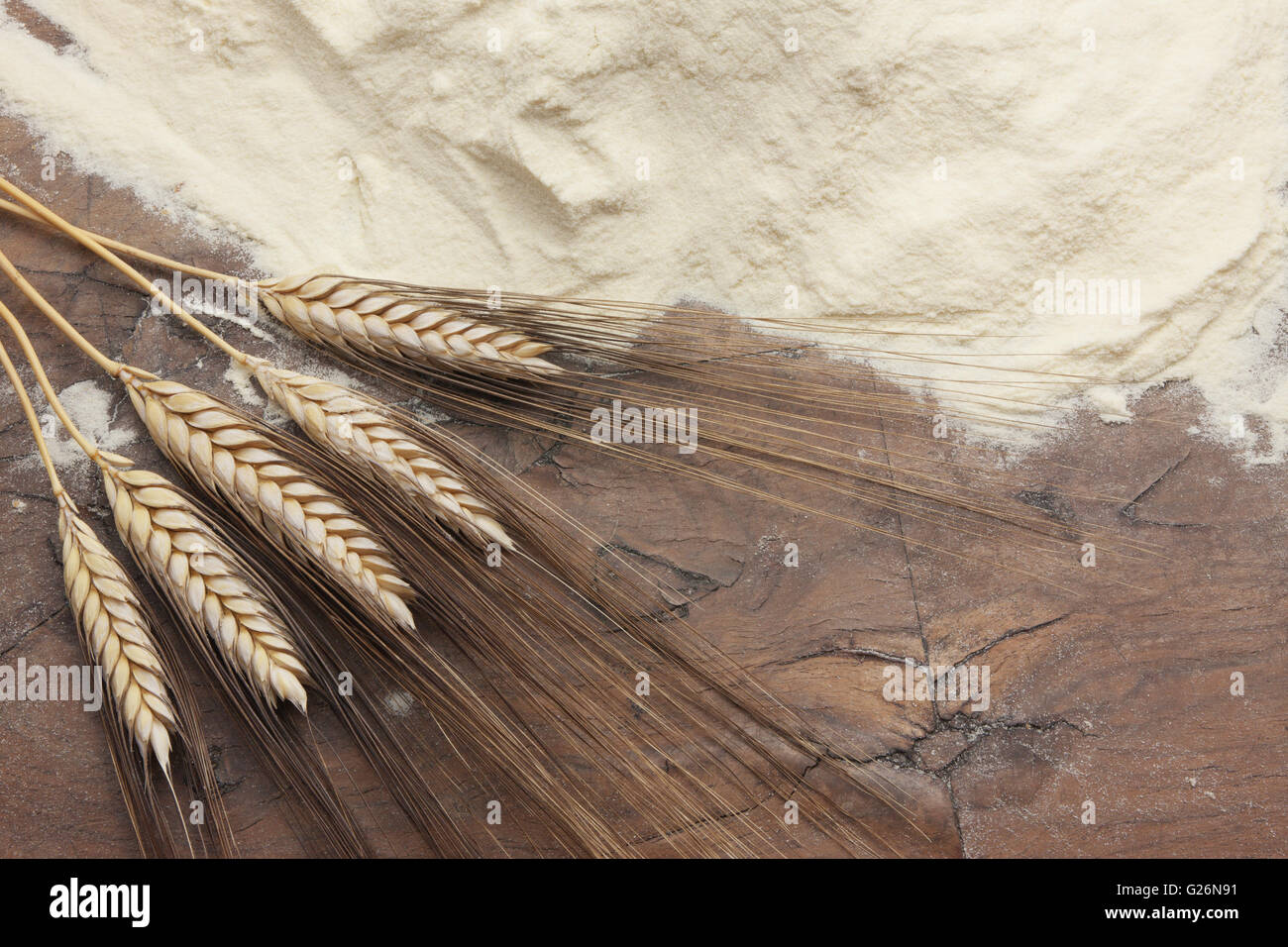 Flour and wheat on  a wooden table Stock Photo