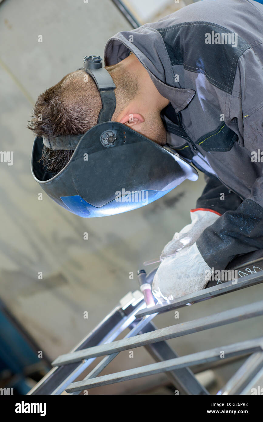 Young man welding Stock Photo