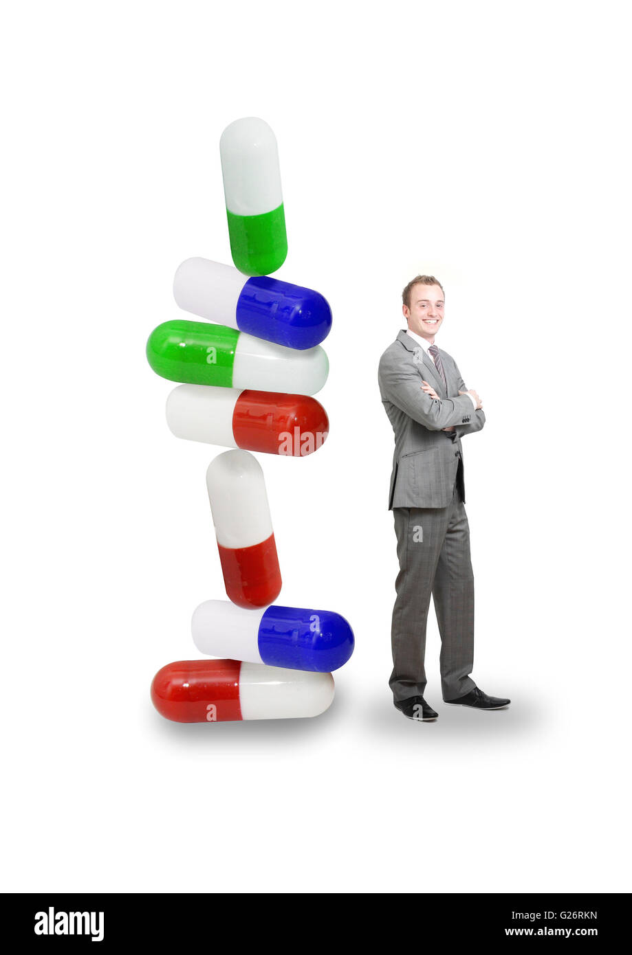 Pills in a stack with businessman Stock Photo
