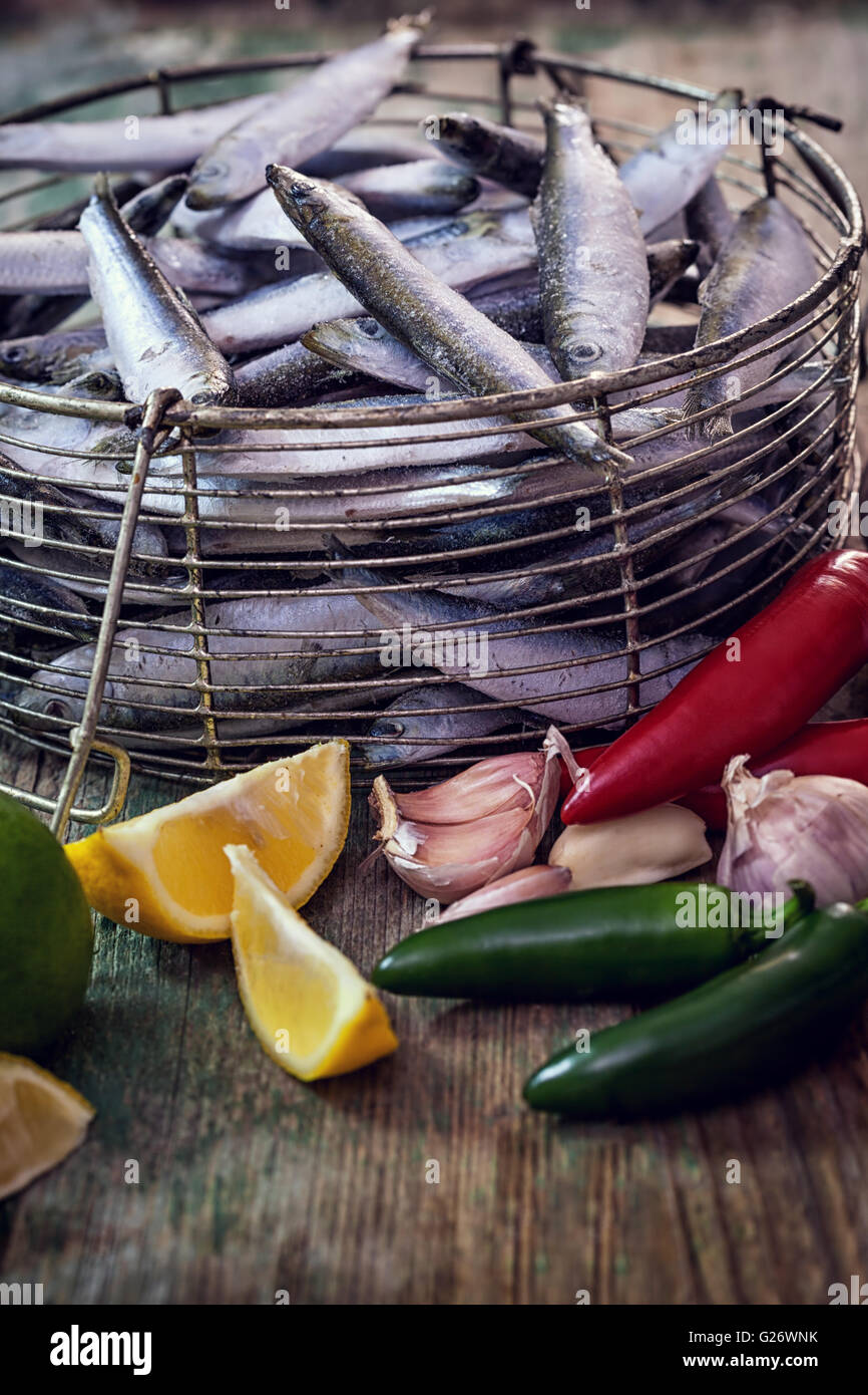 Fresh sardines with garlic, lemon and Jalapeno peppers Stock Photo Alamy