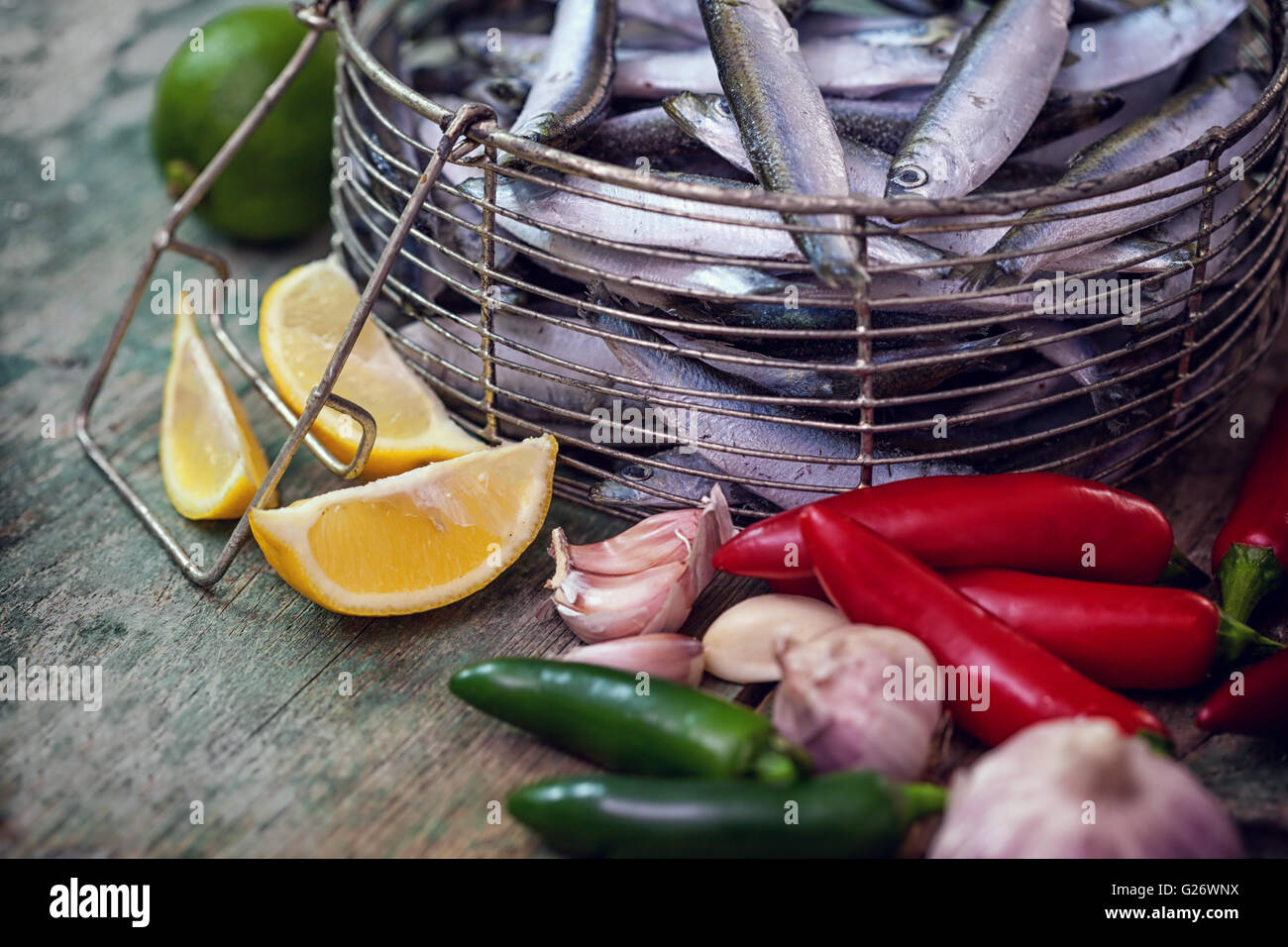 Fresh sardines with garlic, lemon and Jalapeno peppers Stock Photo Alamy