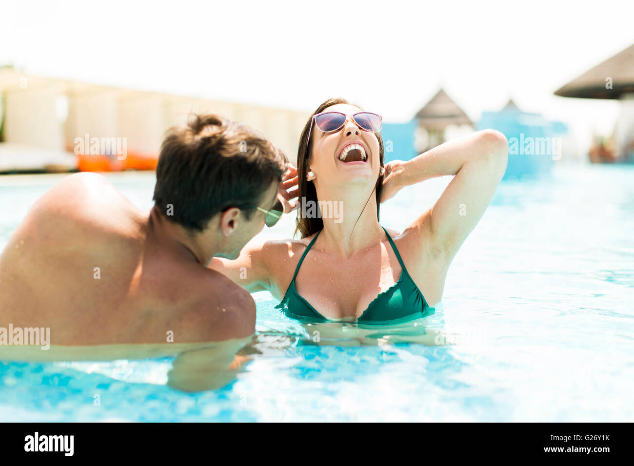 Couple in the pool in the summertime Stock Photo
