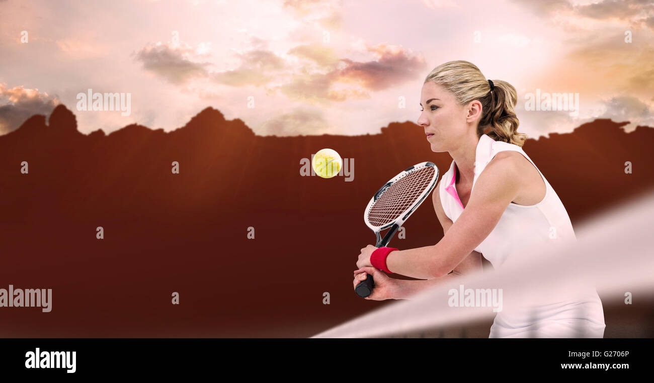 Composite image of athlete playing tennis with a racket Stock Photo
