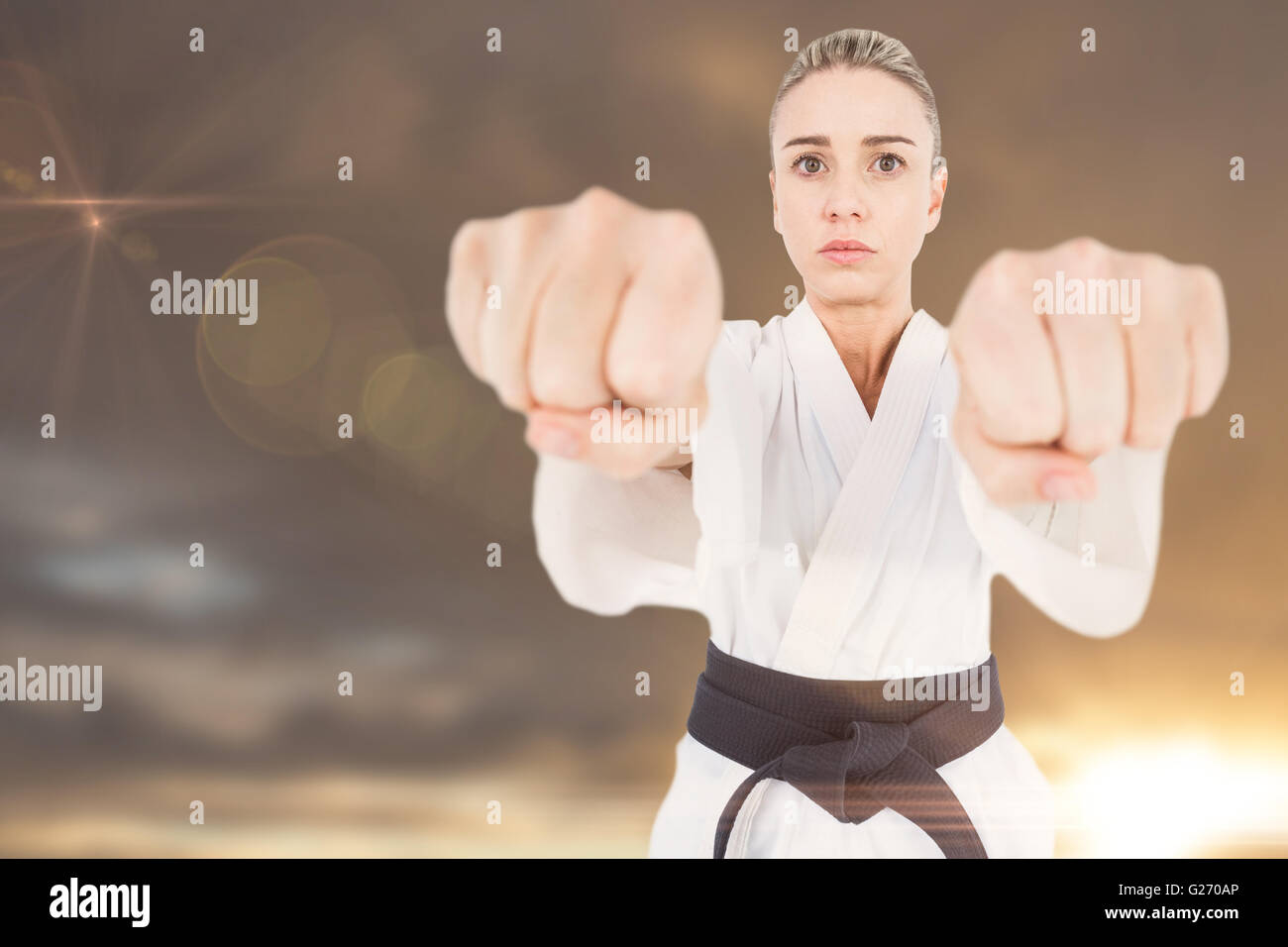 Composite image of female athlete practicing judo Stock Photo