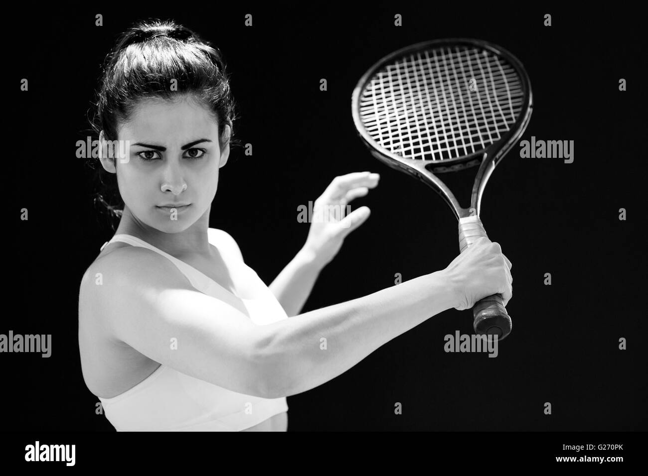 Portrait of confident female tennis player with racquet Stock Photo