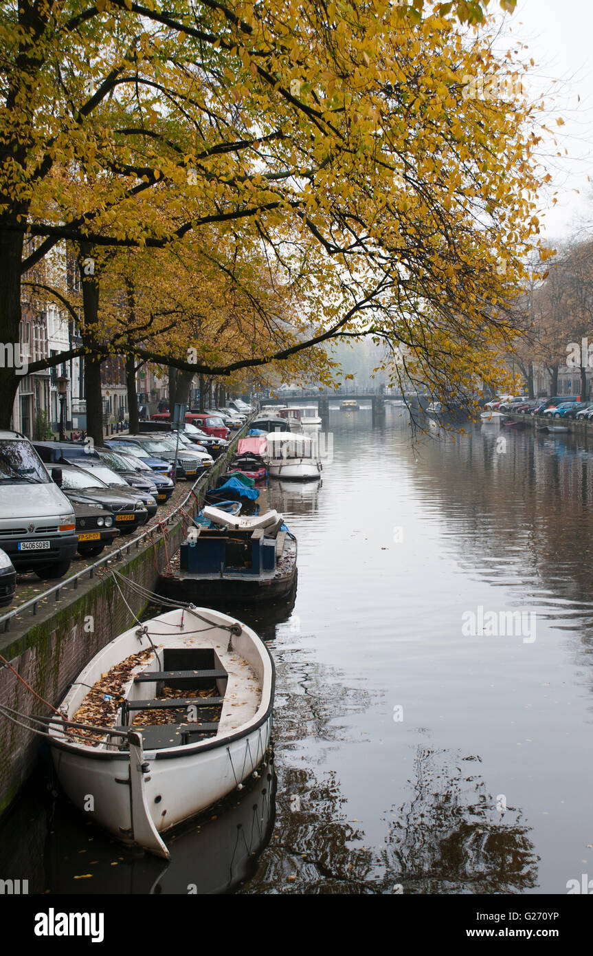 A canal in Amsterdam Netherlands on a foggy morning. Stock Photo