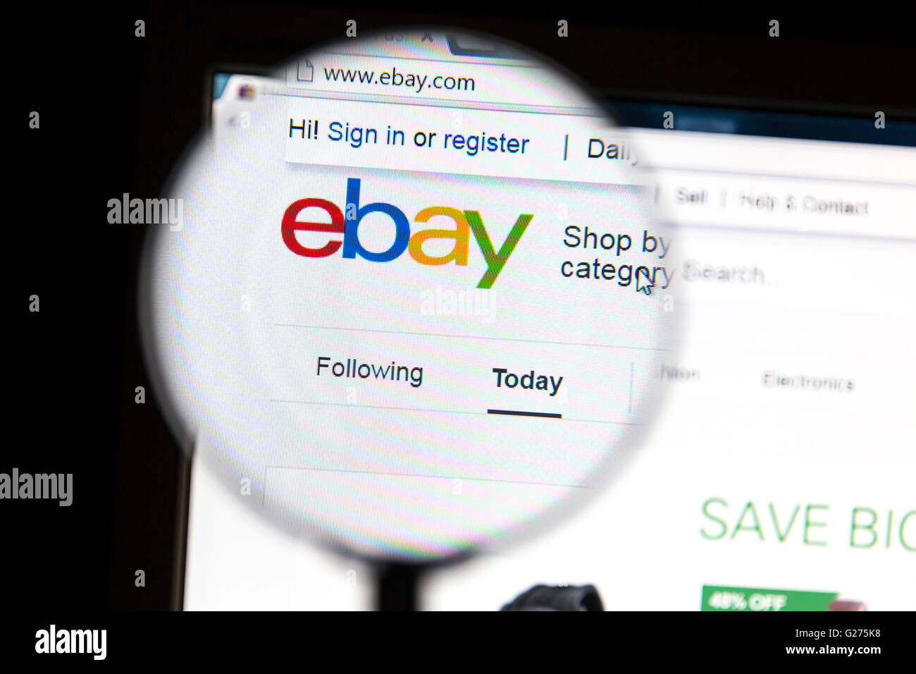 Closeup of ebay website under a magnifying glass. eBay is an american multinational corporatio Stock Photo