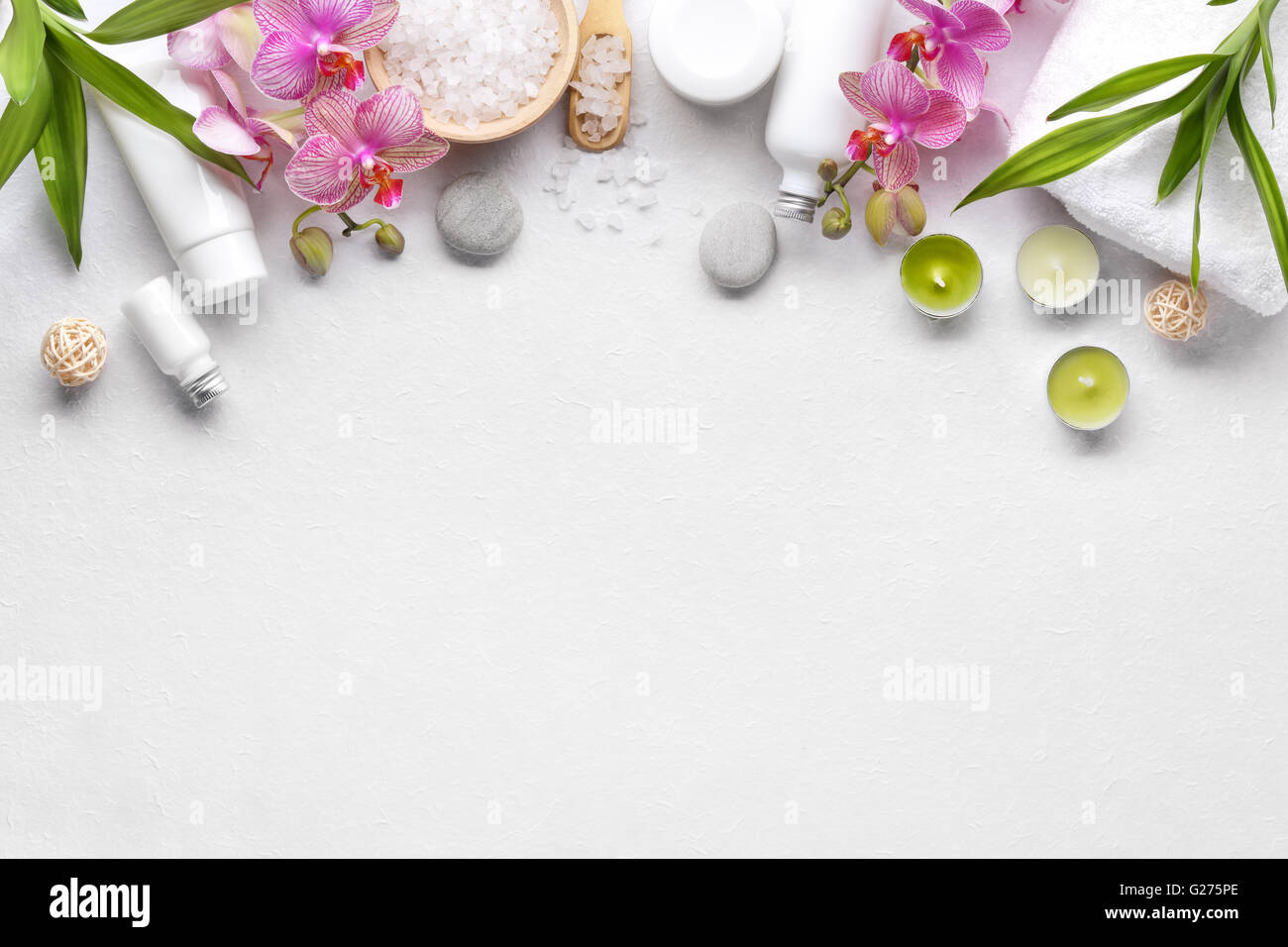 Towel,orchid flowers,bamboo leaf and cosmetics Stock Photo