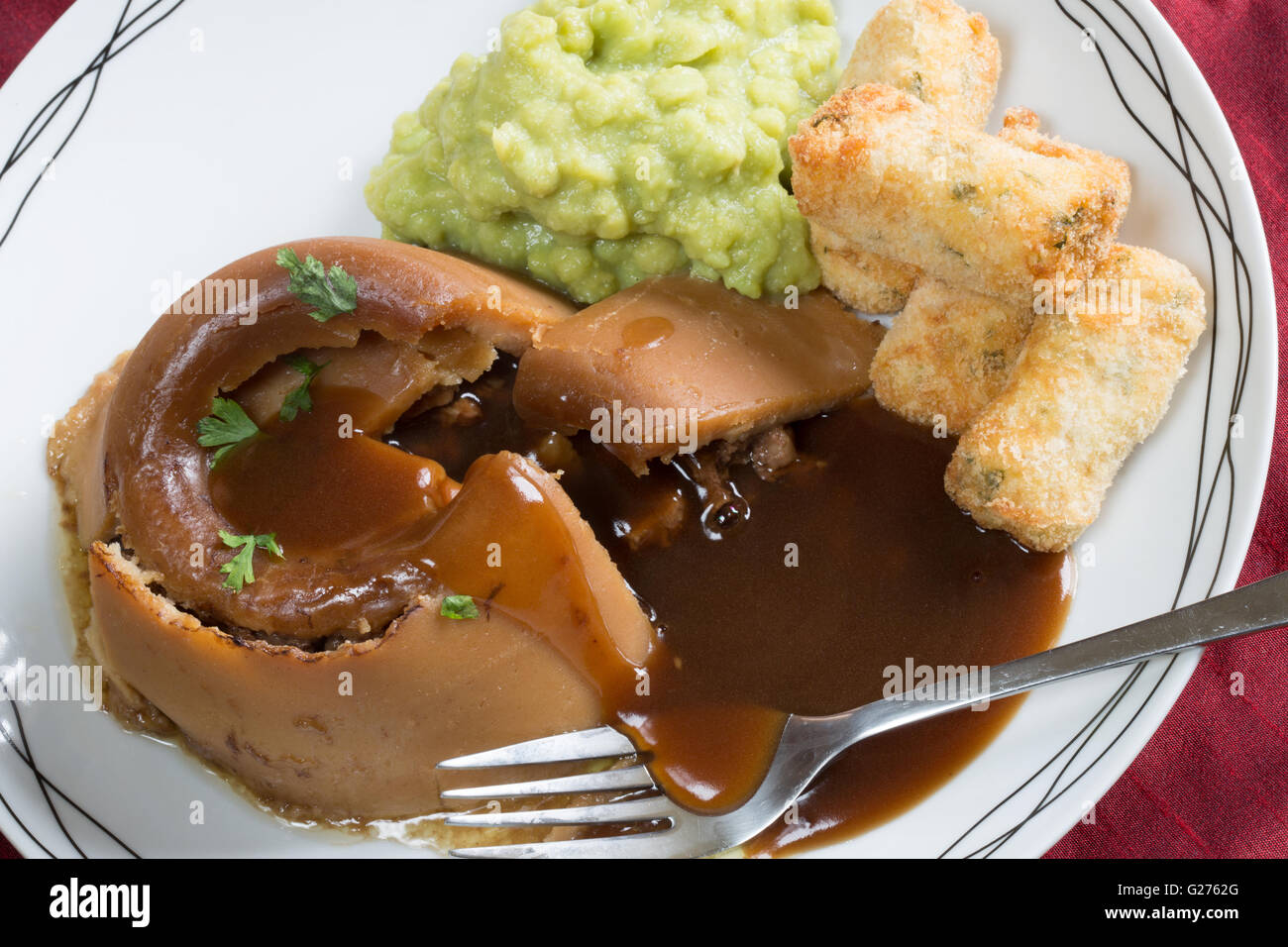 A classic English dish of Steak and Kidney Suet Pudding served with