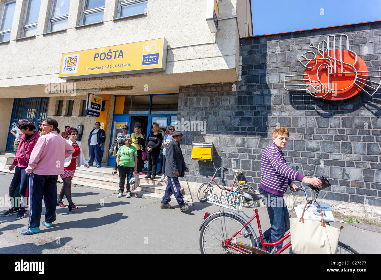 People in front of the local Post office, Filakovo, Slovakia Stock Photo
