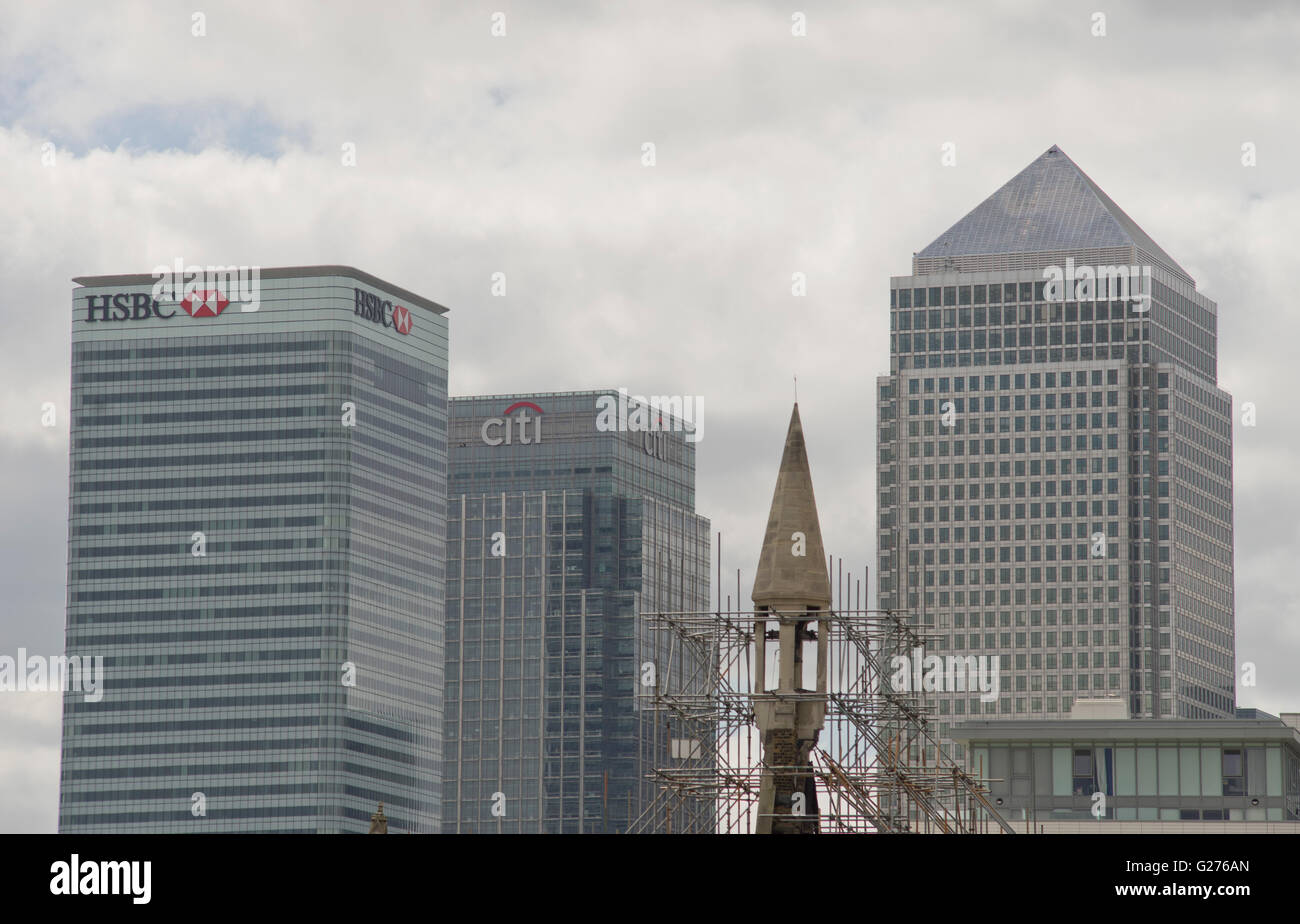 Mosque being refurbished, with Canary Wharf in background at Poplar, London, UK Stock Photo