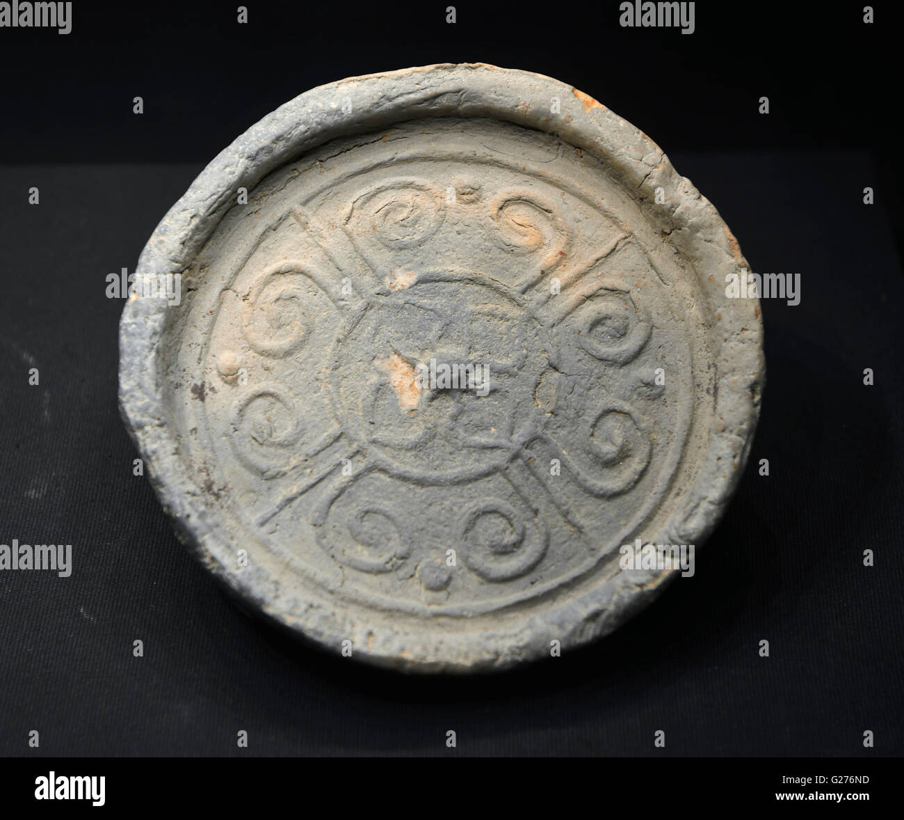An eaves tile unearthed from the tomb in the Haihunhou (Marquis of Haihun) cemetery. Beijing Capital Museum. Stock Photo