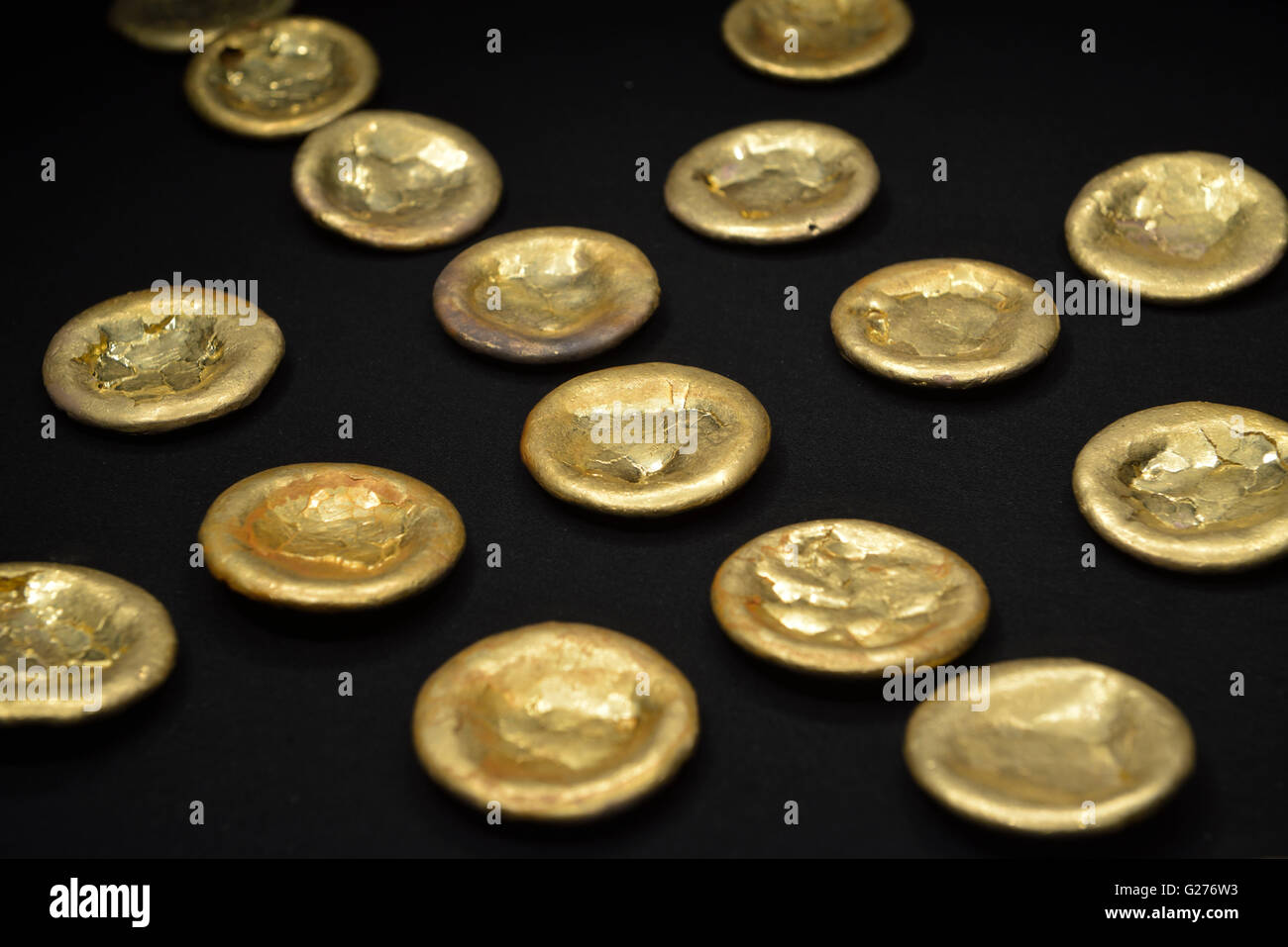 Gold cakes unearthed from the tomb in the Haihunhou (Marquis of Haihun) cemetery. Beijing Capital Museum. Stock Photo