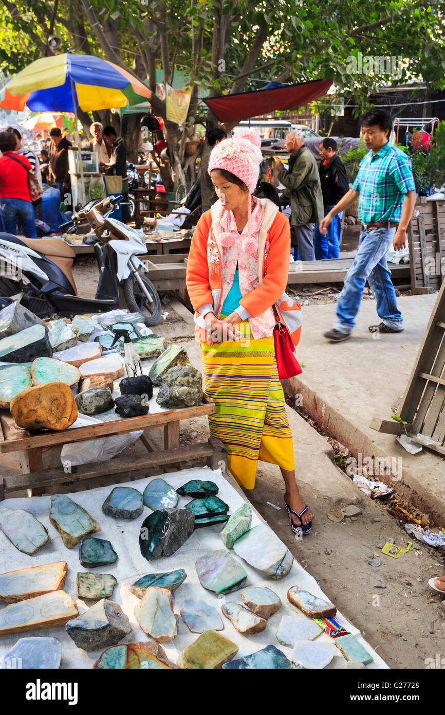 Seller with display of rough cut pieces of jade on sale at the roadside at  the Jade Market, Mandalay, Myanmar (Burma Stock Photo - Alamy