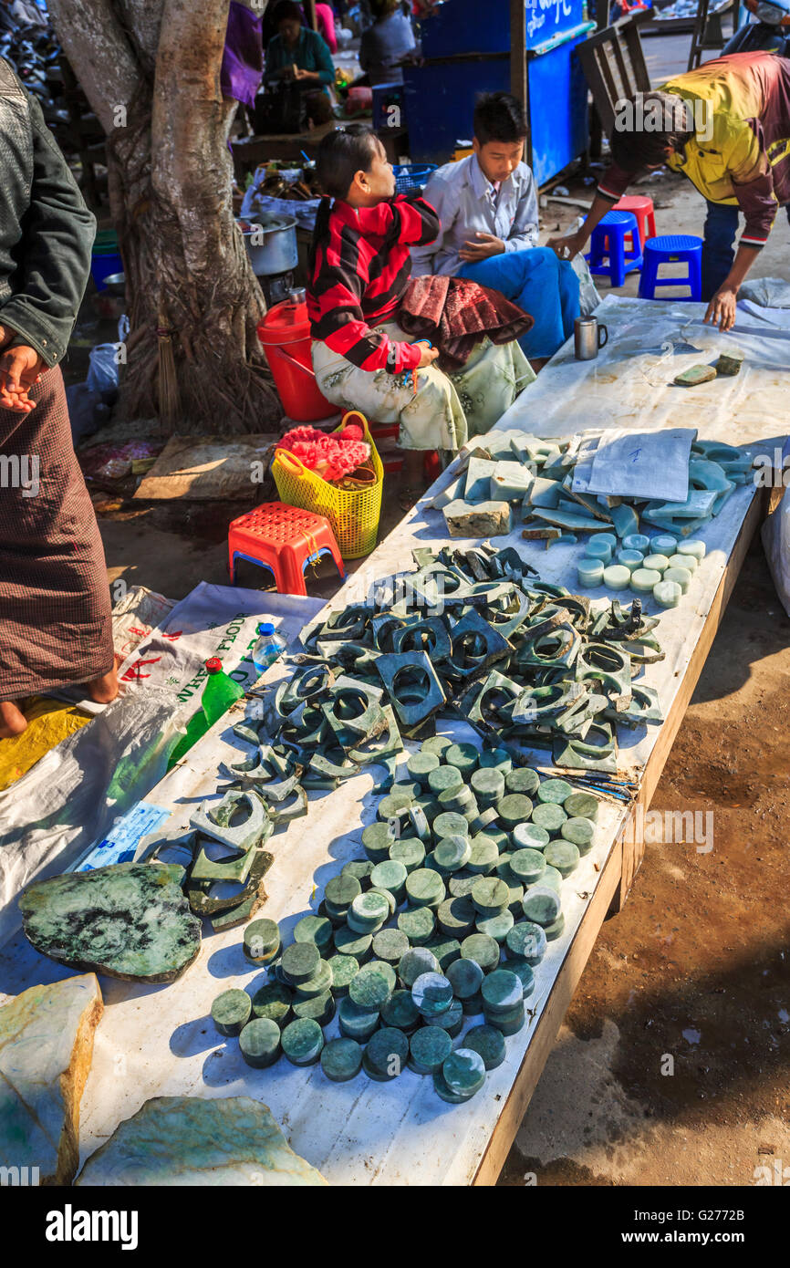 Display of round cut polished pieces of jade on sale at the roadside