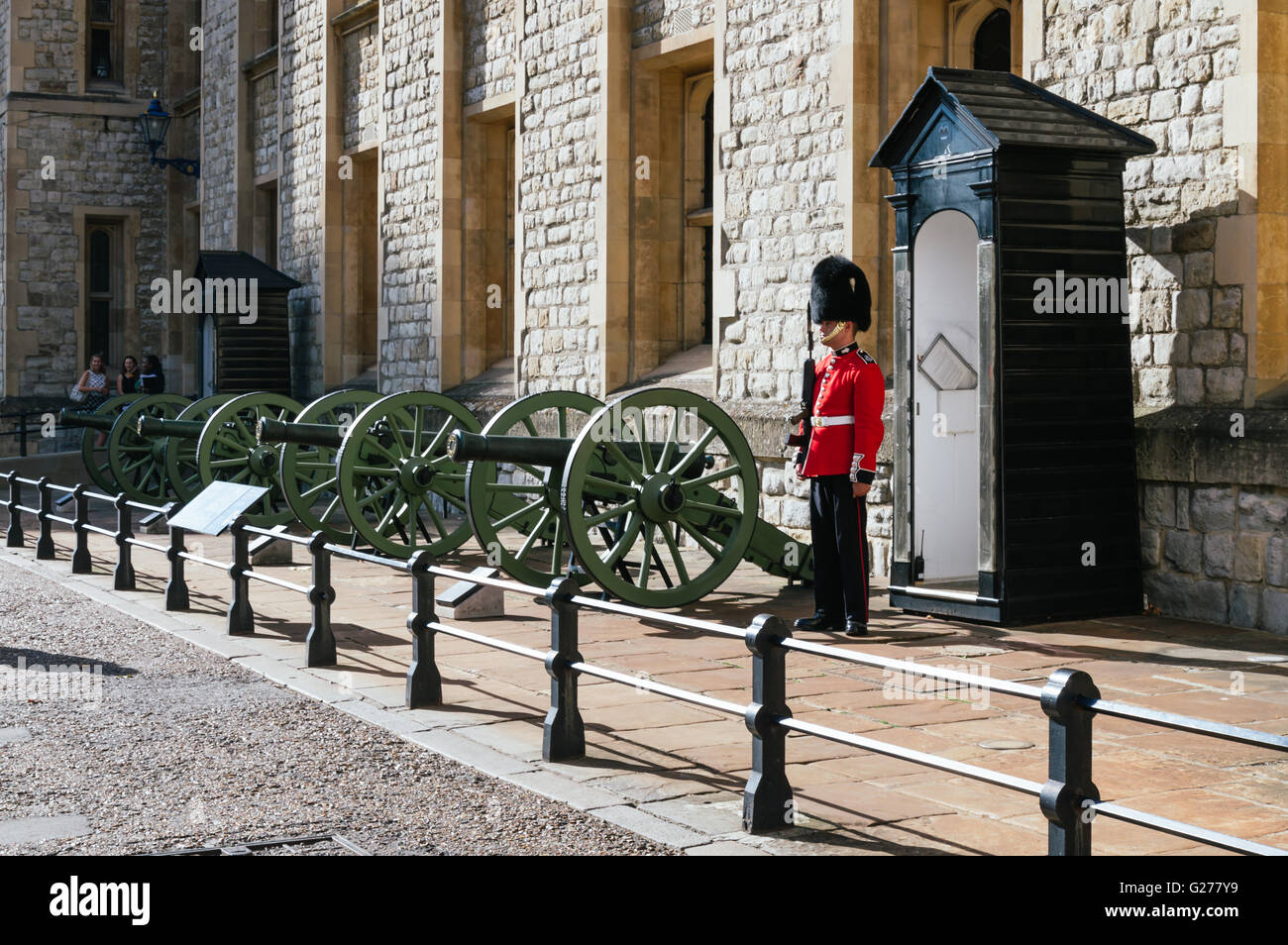 LONDON, UK - AUGUST 21, 2015:  Queen's Guard and guns - Tower of London. Stock Photo