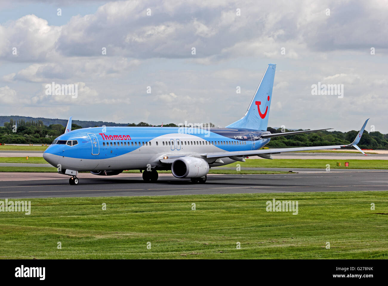 Thomson Airlines Boeing 737-3 airliner taxiing at Manchester International Airport. Stock Photo