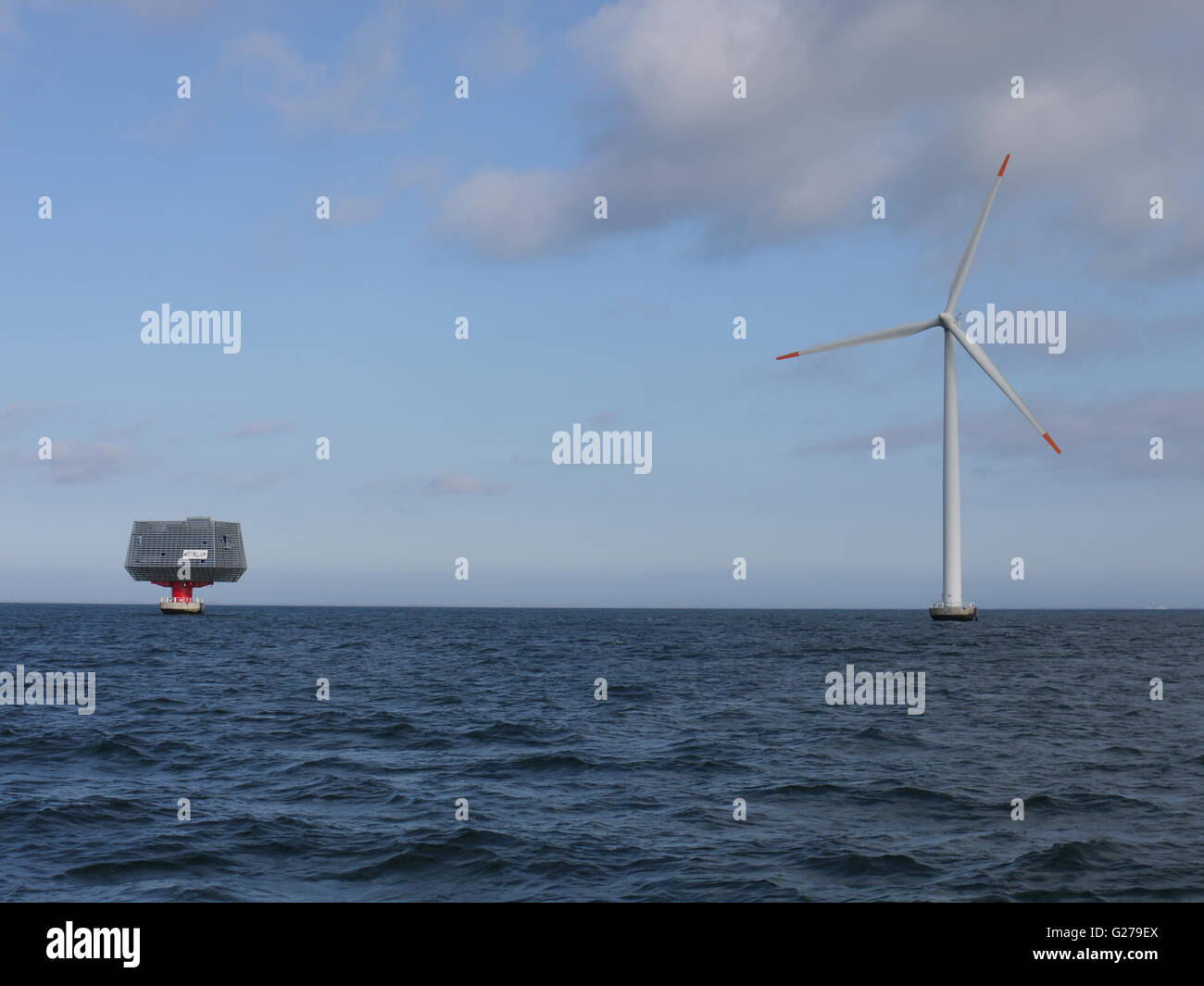 Off shore wind turbine and sub-station in south of Denmark for production of sustainable electricity Stock Photo