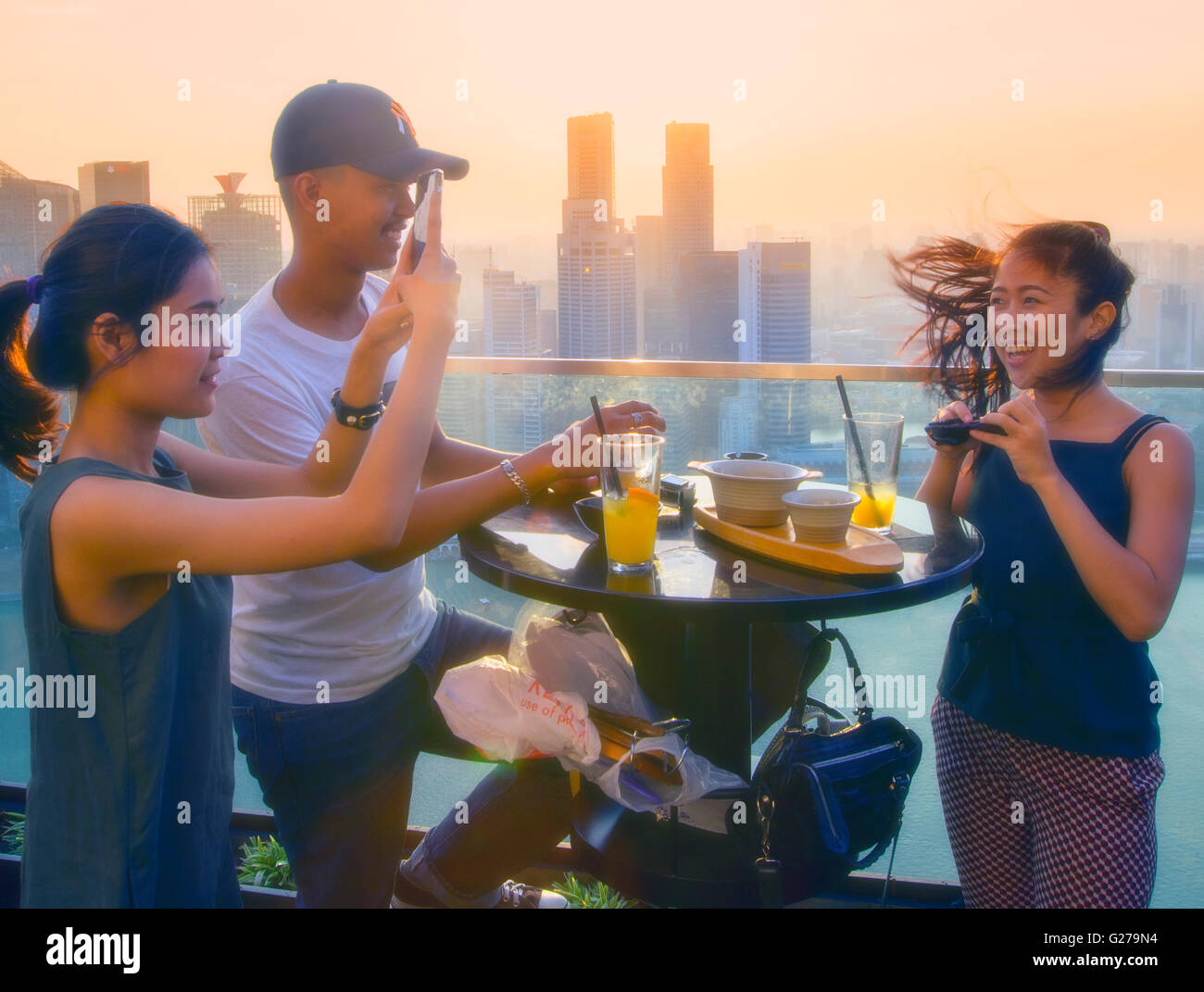 Young people relaxing in the Marina Bay Sands skypark Stock Photo