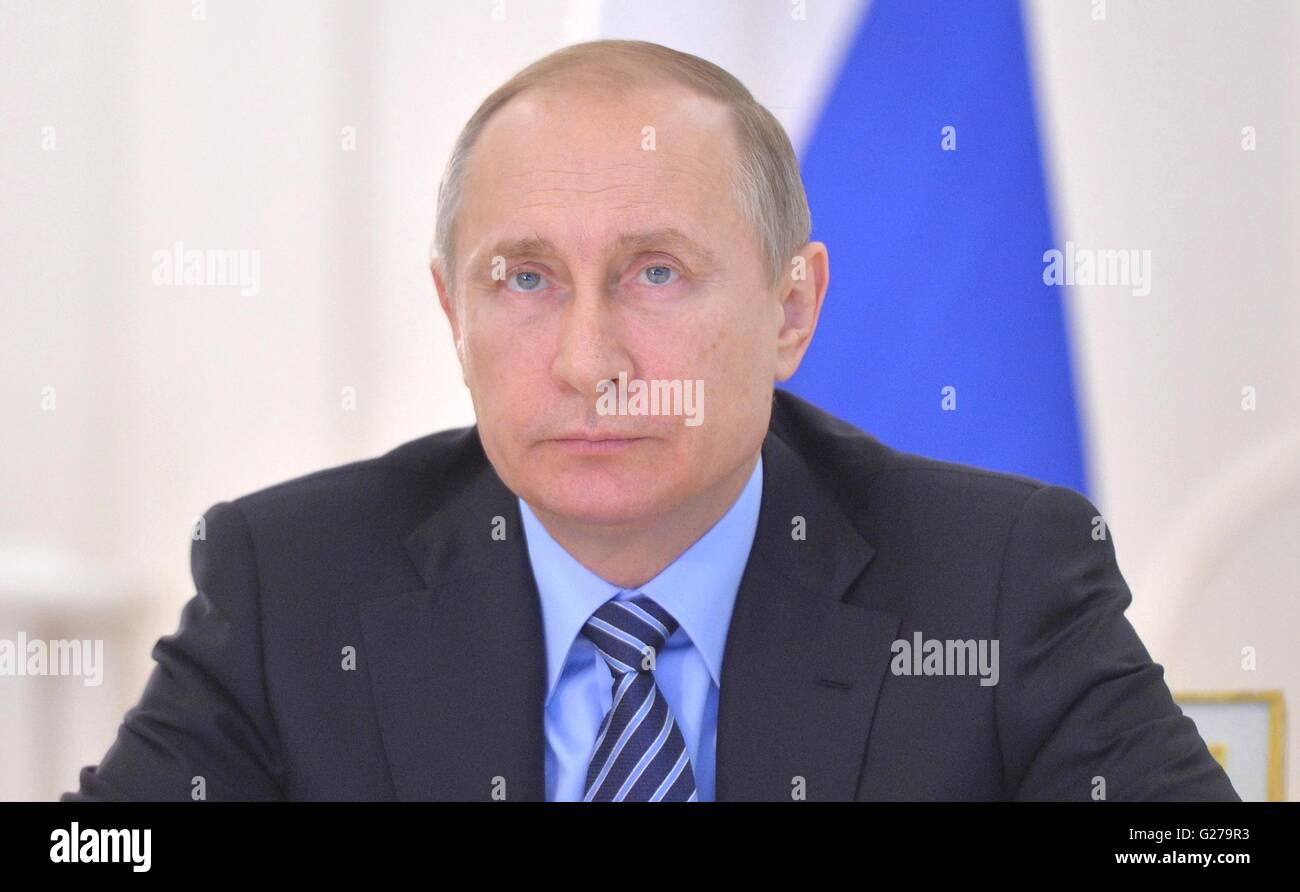 Russian President Vladimir Putin watches the first oil tanker loading at the Arctic Gate terminal with oil from the Novoportovskoye field during a video conference in the Situation Center at the Kremlin May 25, 2016 in Moscow, Russia. Stock Photo