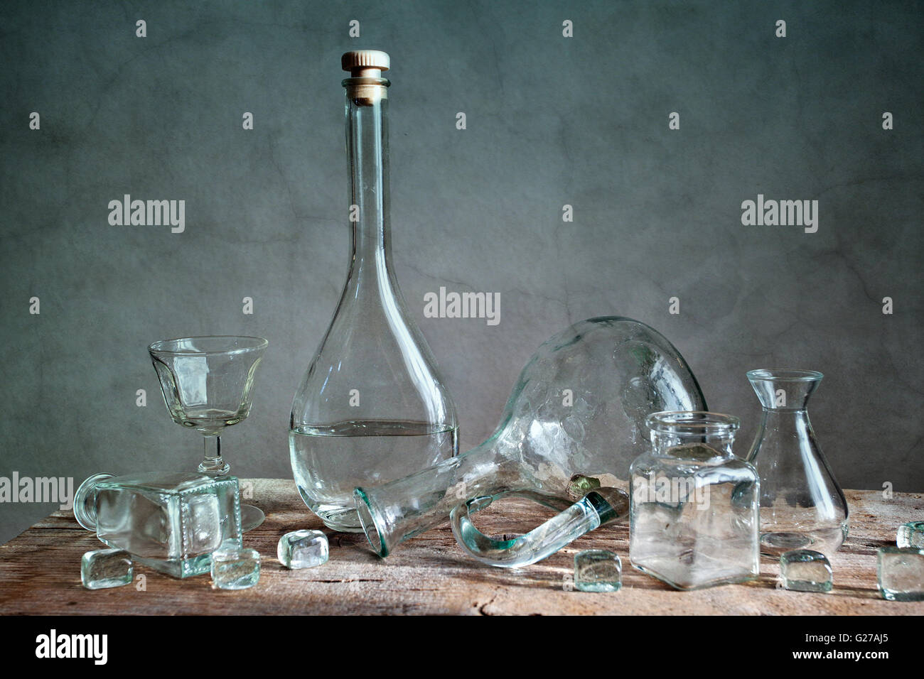 Still Life with differently shaped glass bottles Stock Photo