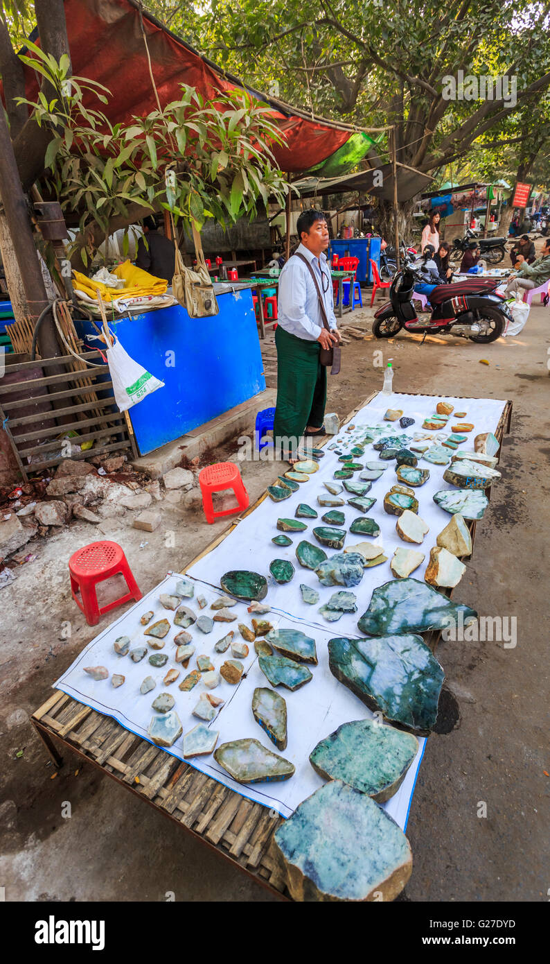 Rough cut and polished jade stones on sale on a roadside stall at the