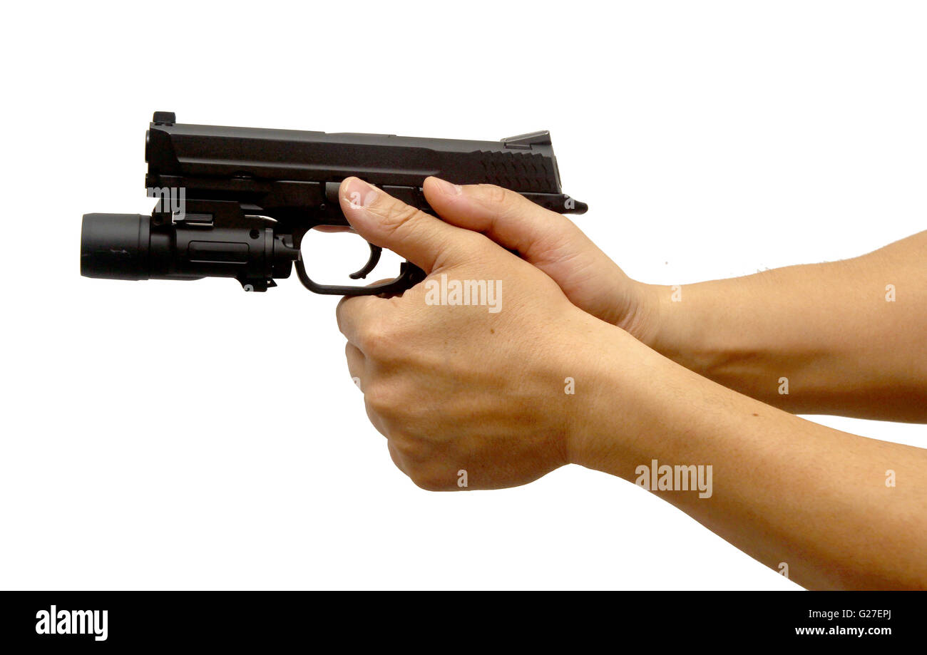 a hand shooting a gun tactical light kill murder danger crime scene Stock Photo