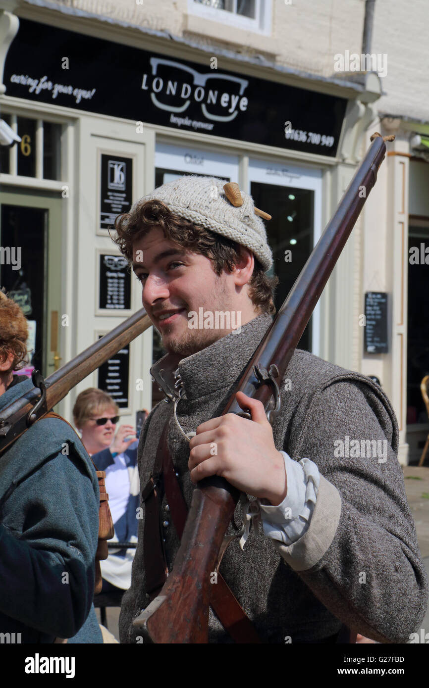 Member of the sealed knot historical society carrying a rifle while marching through Newark on Trent Stock Photo