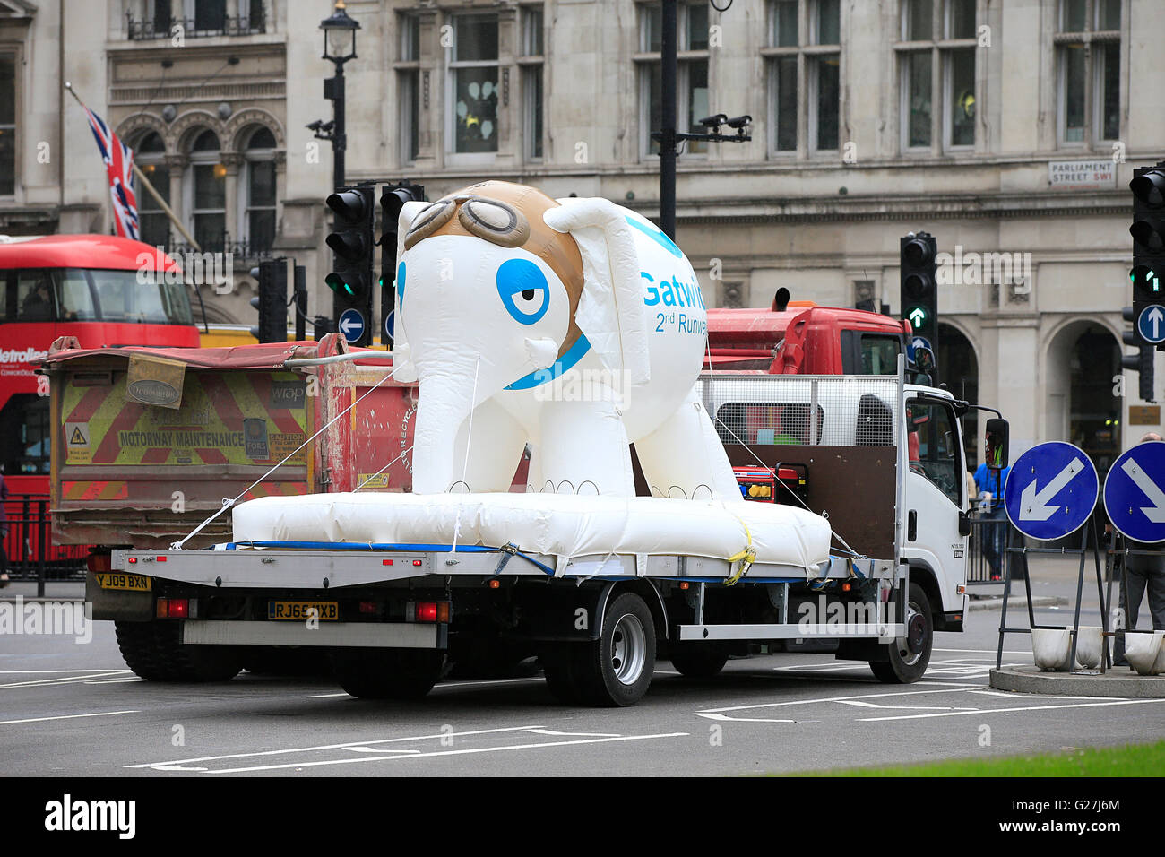A giant inflatable elephant emblazoned with 'Gatwick 2nd Runway' passes through Westminster in central London, to demonstrate concerns that new runway at Gatwick Airport risks becoming a 'white elephant'. Stock Photo