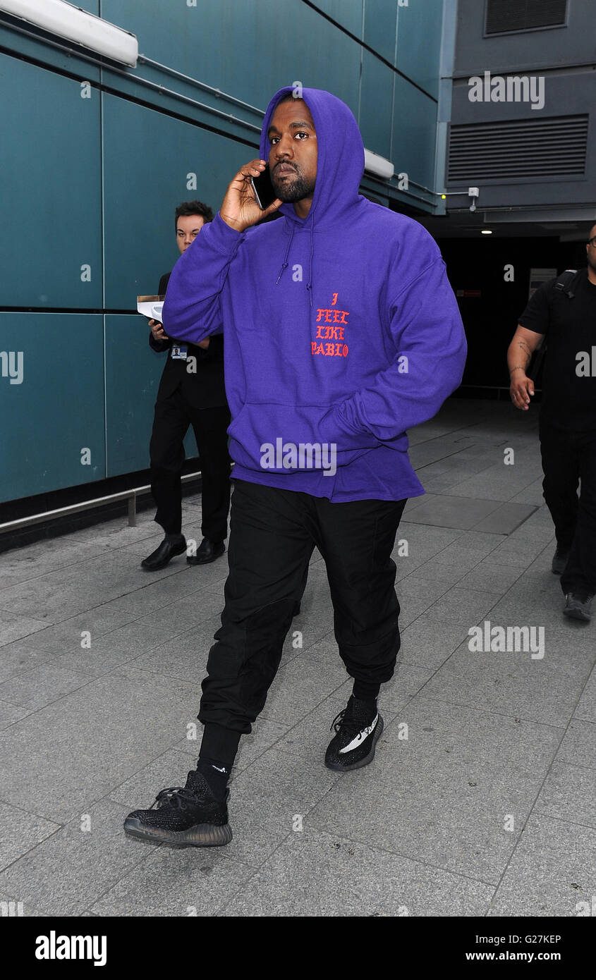 Kanye West arriving at Heathrow Airport all smiles. Kanye was wearing an as  yet unreleased pair of his Yeezy Boost 350 trainers, as well as a Pablo  hoodie, to promote his new