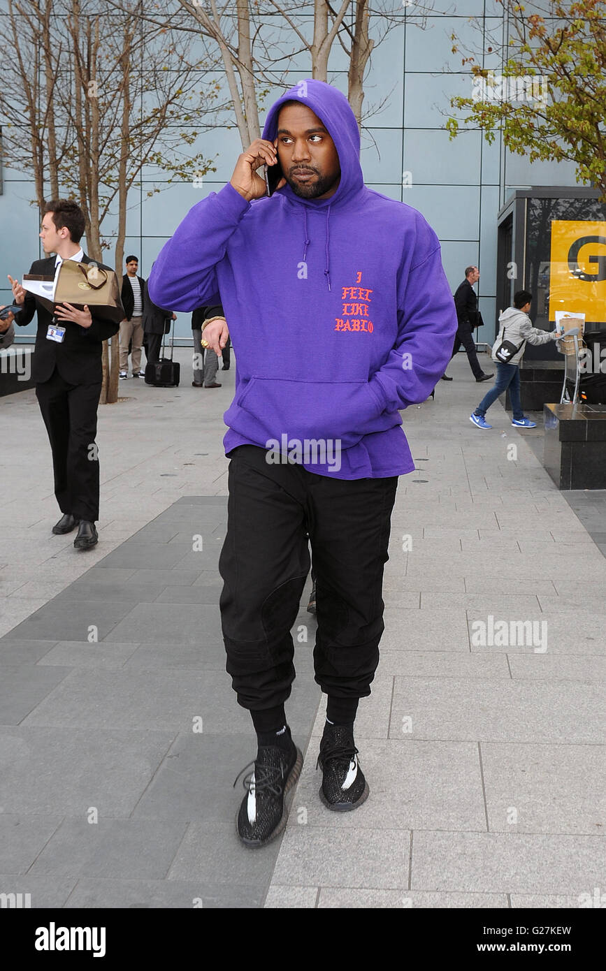 Kanye West arriving at Heathrow Airport all smiles. Kanye was wearing an as  yet unreleased pair of his Yeezy Boost 350 trainers, as well as a Pablo  hoodie, to promote his new