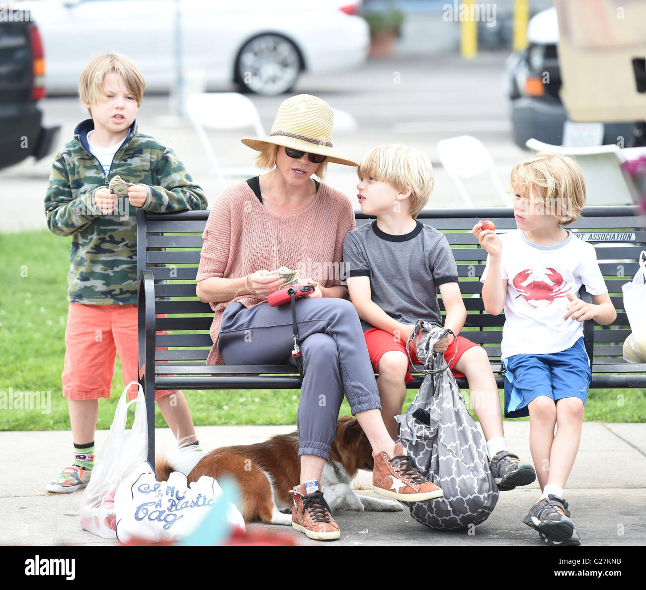 Julie Bowen entertains her three boys during a trip to the Farmers