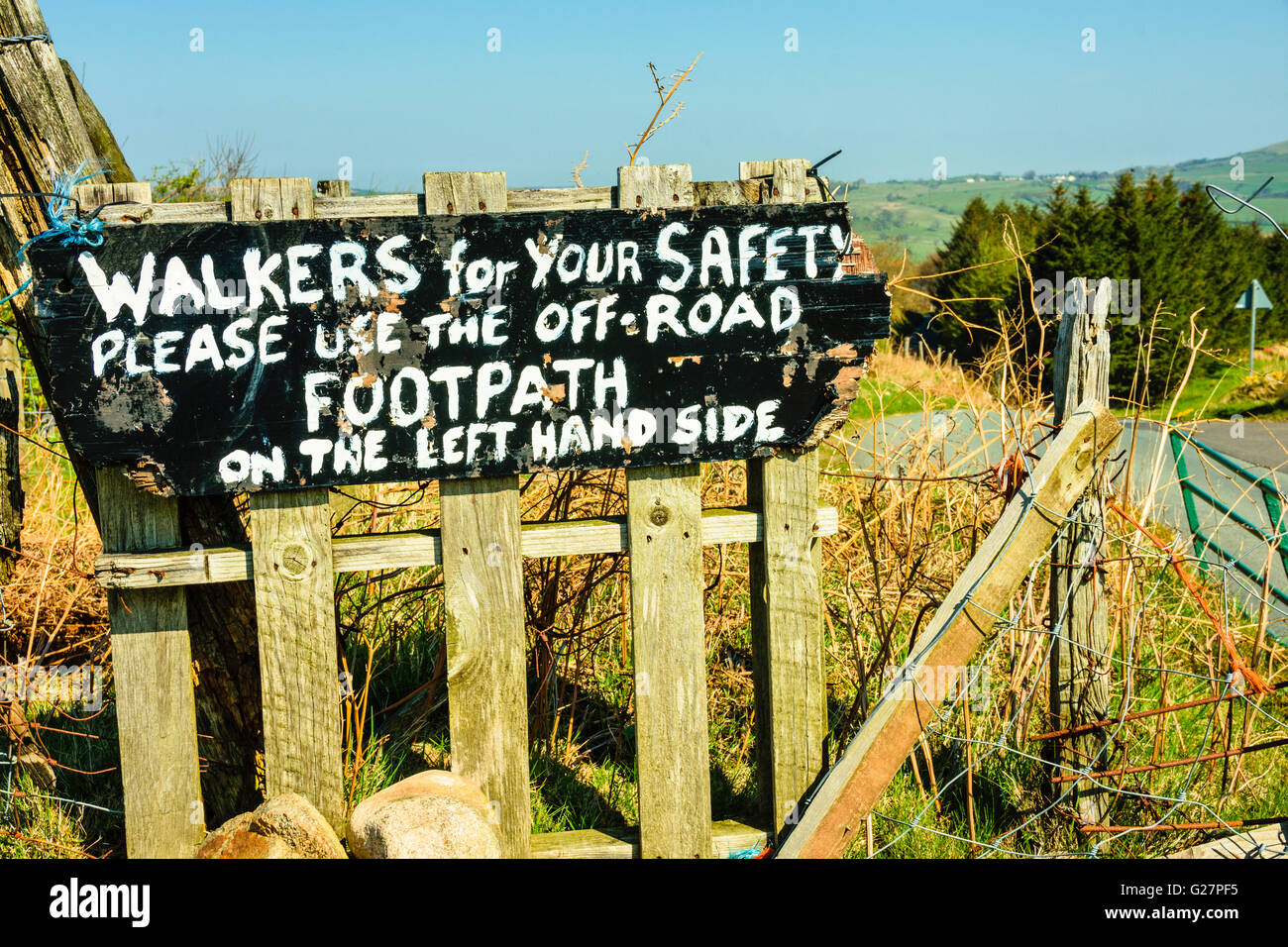 Warning sign for walkers on lane near Ennerdale Bridge in the Lake District Stock Photo