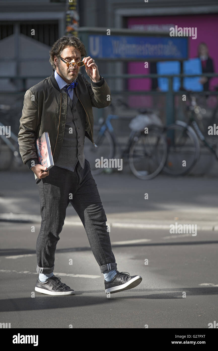 German actor Falk Willy Wild out and about with a book in Mitte.  Featuring: Falk Willy Wild Where: Berlin, Germany When: 07 Apr 2016 Stock Photo