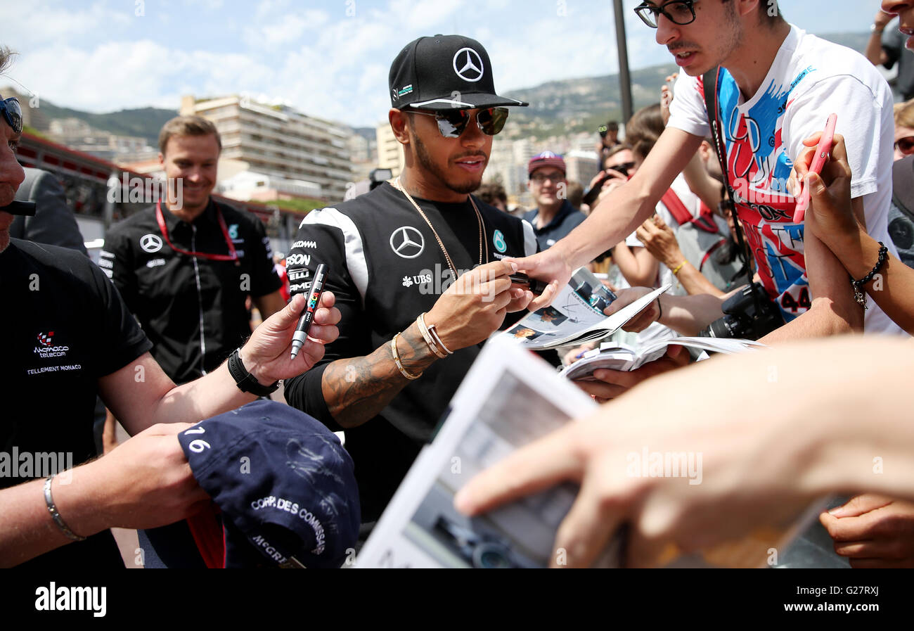 Mercedes' driver Lewis Hamilton signs autographs at the Circuit de