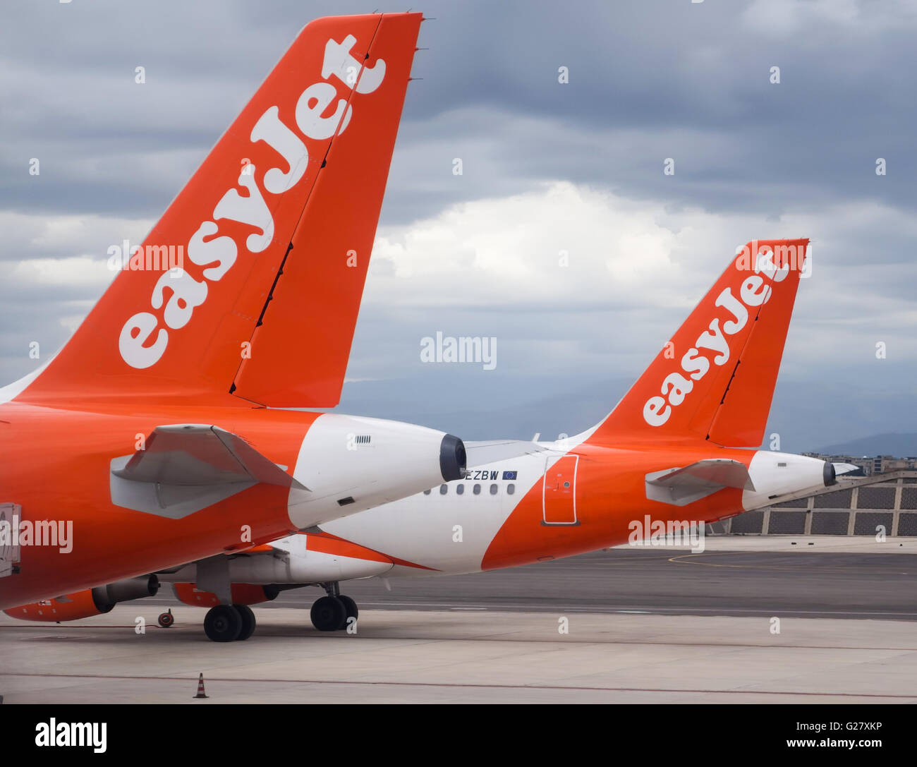 tail fins of Easyjet Airbus A319-111 planes on the tarmac at Naples Airport Stock Photo
