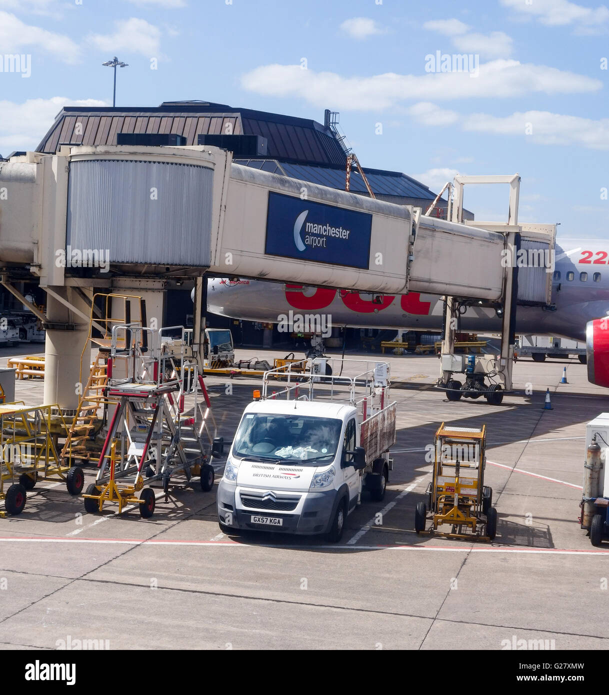 A jet bridge or passenger boarding bridge at Manchester Airport England UK Stock Photo