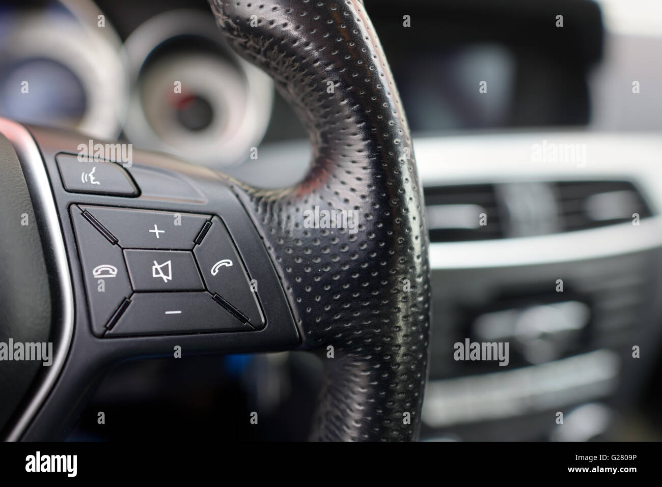 Steering wheel of modern car, details of phone adjustment controls Stock Photo