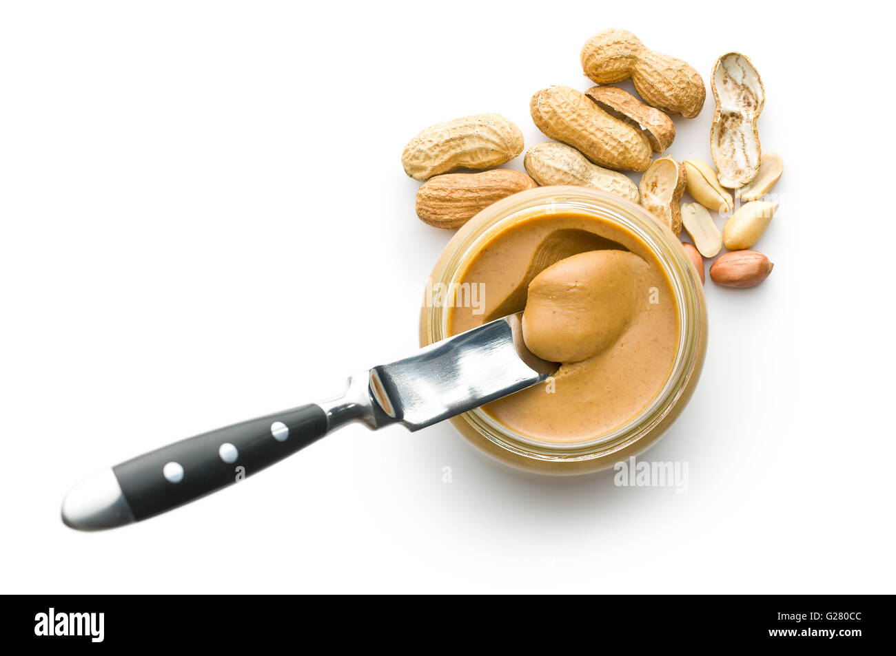Creamy peanut butter and peanuts isolated on white background. Spreads peanut butter in the jar