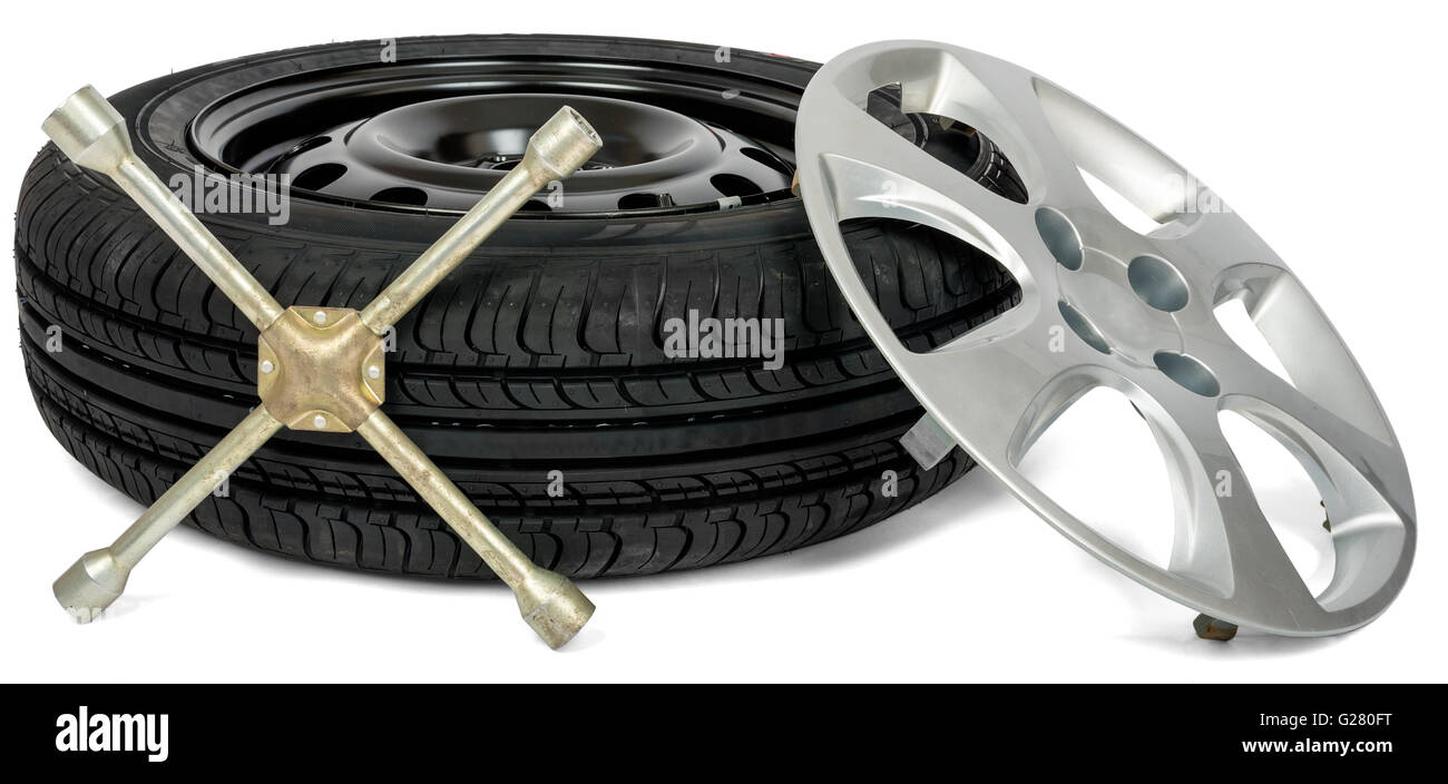 Tyre with screwdriver and wheel cap Stock Photo Alamy