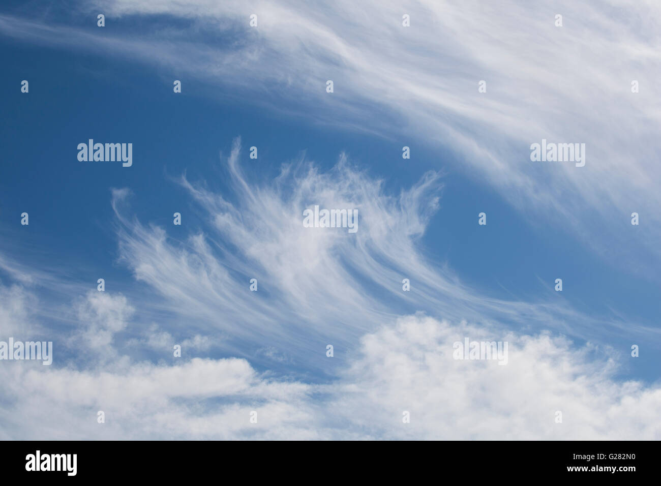 White cirrus and cumulus clouds on a sunny blue sky Stock Photo - Alamy