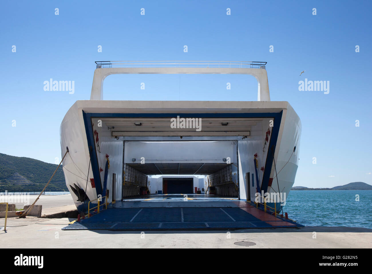 Big ship ferry boat waiting at a port to be loaded with vehicles and passengers. Stock Photo