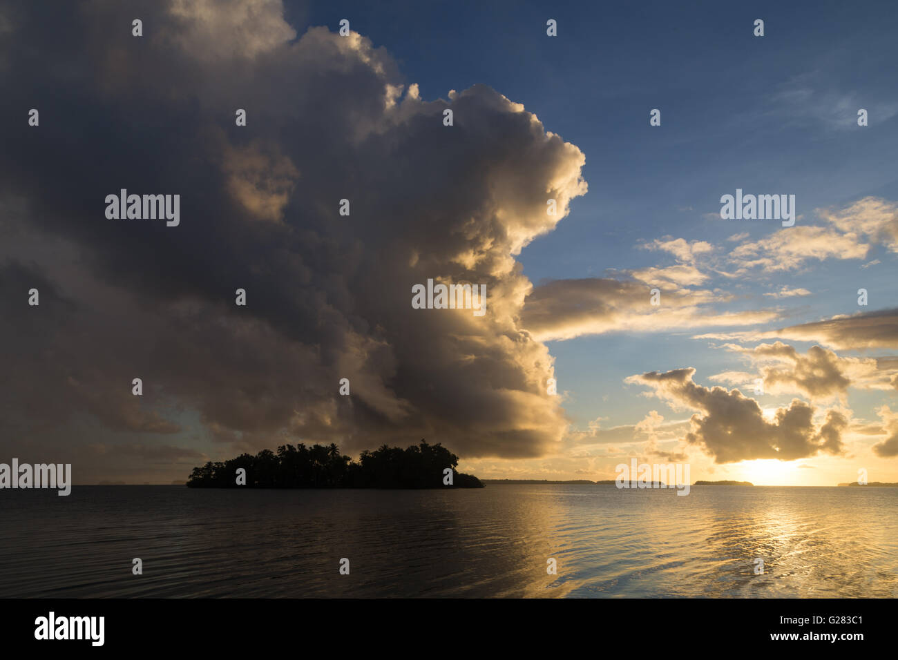 Lonely island and beautiful sunrise in the Solomon Islands Stock Photo